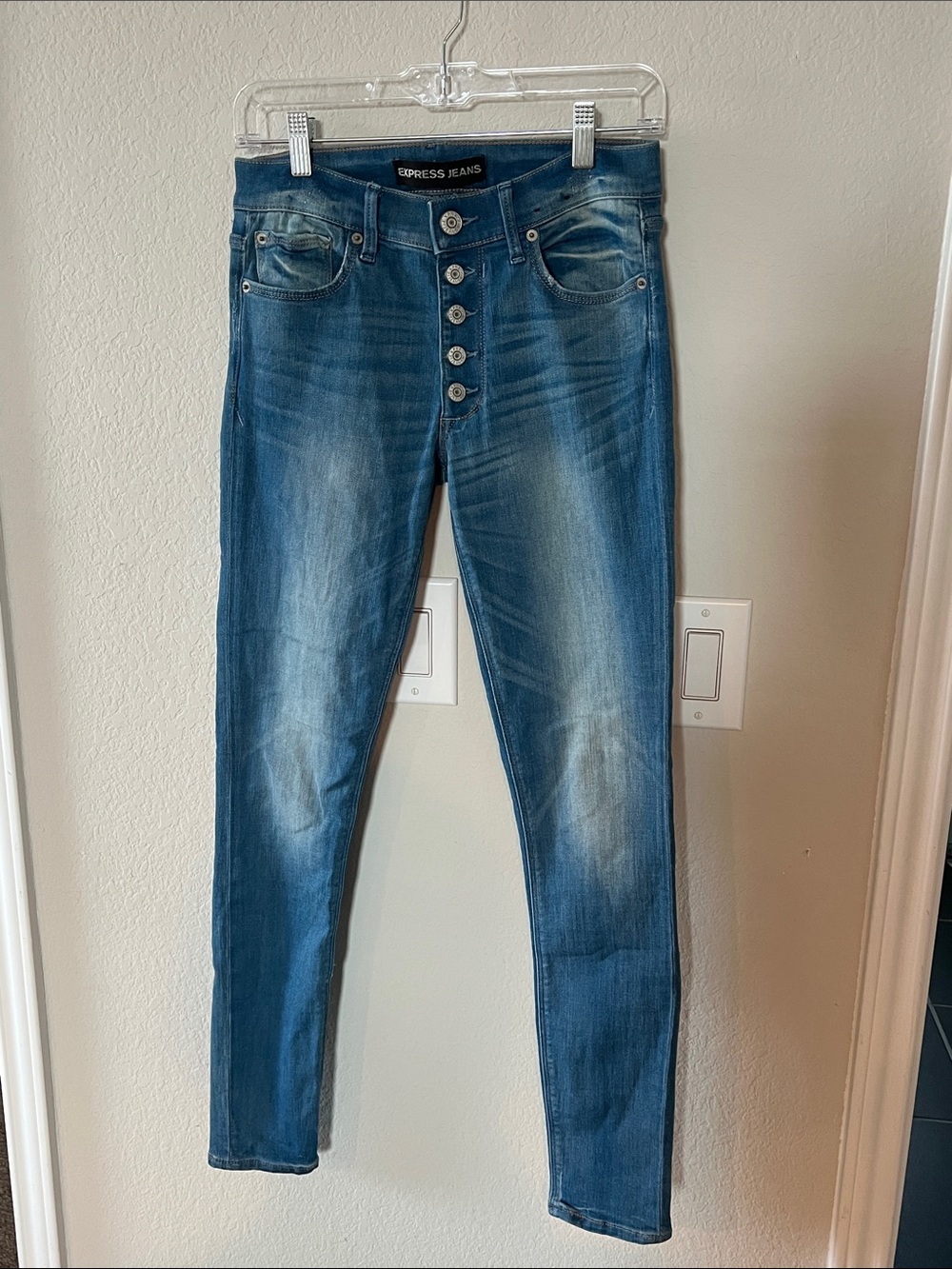 Express Women’s Medium Blue Wash mid-rise leggings- size 4R